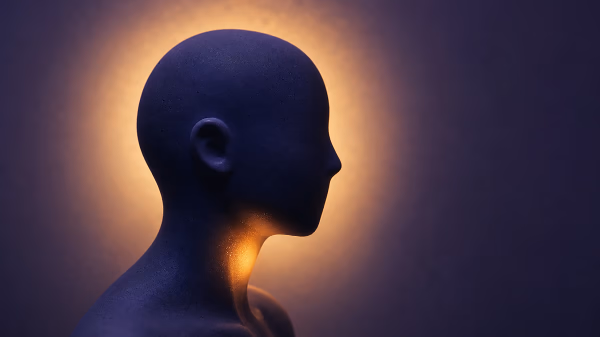A calm indigo profile illuminated by a warm glow at the throat